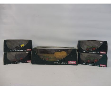 Five Schuco models comprising a Diorama and four 1/43 scale tractors. 