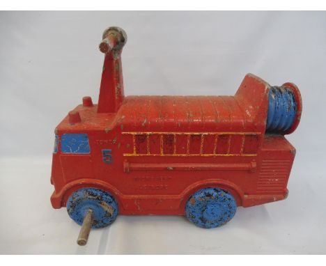 A municipal use cast aluminium junvenile ride in the form of a fire engine, by Wicksteed Leisure.