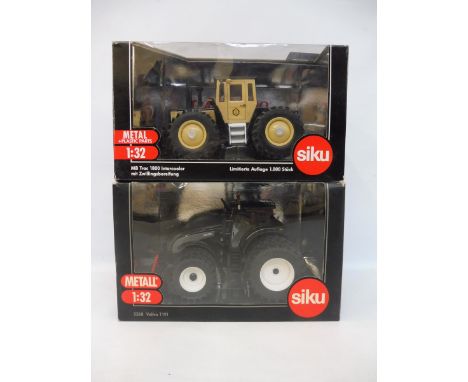 Two 1/32 scale heavy tractors including the Valtra T191 and the MB Track 1800.