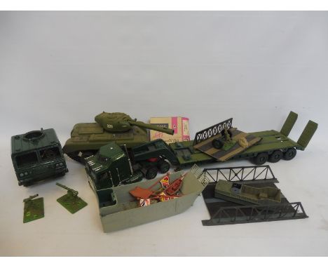 A box full of large scale painted military vehicles. 