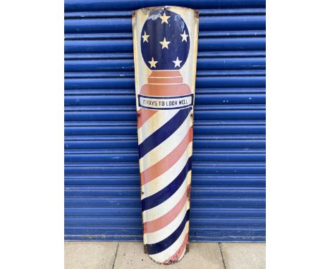 An unusual semi-circular barber pole style enamel sign bearing the words 'It pays to look well', 12 x 48". 