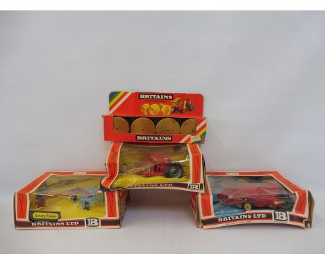 Four boxed Britains Farm Implements and Accessories - no. 9541, 9556, 1743 and 9577 Seed Drill. 