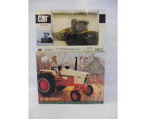 A boxed Fox Fire Farm 'The Last Cowboy' model tractor and a boxed 1/32 scale Cat MT765 Challenger Tractor. 