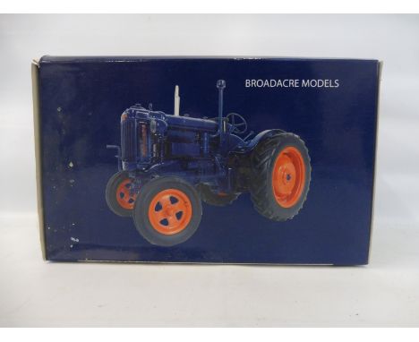 A 1/16 scale Universal Hobbies boxed model tractor of a Fordson Major E27N.