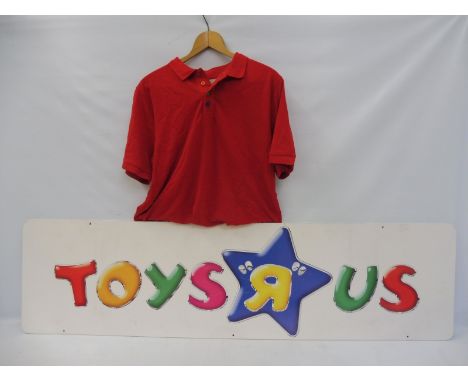 A Toys r Us shop display advertising sign plus a t-shirt and a quantity of original MacDonalds toys.