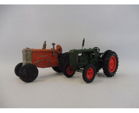 Two vintage die-cast tractors, one possibly an early Crescent model. 