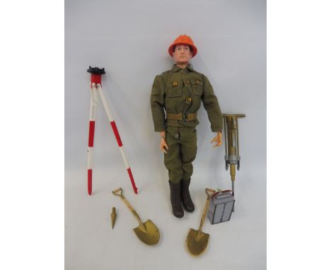 Original Man - a 1960s figure painted head wearing rare combat construction engineer, complete with drill and theodolite.