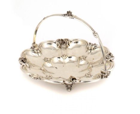 A VICTORIAN SILVER CAKE BASKET  cast and applied with flowers, swing handle, 27cm diam, maker R-, Birmingham 1892, 16ozs ++In