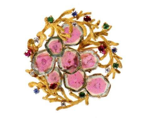 A RUBY, DIAMOND, SAPPHIRE, WATERMELON TOURMALINE AND GOLD BROOCH, C1970  formed of textured fronds ++In fine condition