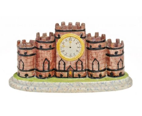 AN EARTHENWARE CASTLE SPILL HOLDER, YORKSHIRE OR STAFFORDSHIRE, C1830 with overglaze enamel painted decoration, 13cm h ++Some