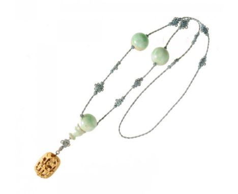 A CHINESE JADEITE AND SILK NECKLACE, EARLY 20TH C  with three 22mm jade beads and associated 19th c Chinese carved ivory plaq