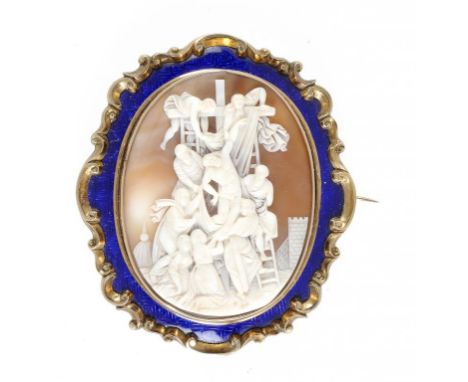 A VICTORIAN CAMEO BROOCH, C1860 the oval bull's mouth shell very finely carved with the Descent from the Cross, in translucen
