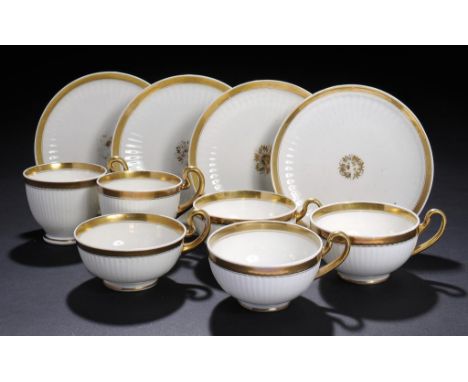 A PAIR OF SWANSEA REEDED GILT TEACUPS AND SAUCERS AND TWO TRIOS, C1820  saucer 15cm diam, red printed mark ++One coffee cup c