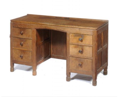 A ROBERT 'MOUSEMAN' THOMPSON OAK DESK, C1930 with adzed top, panelled sides and back, 74cm h; 50 x 137cm, carved mouse 'signa