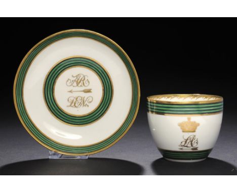 A DERBY GREEN AND BLACK BORDERED TEACUP AND SAUCER, C1785-90 gilt with initials, an arrow and earl's coronet, saucer 13.5cm d