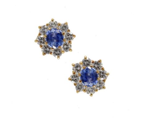 A PAIR OF SAPPHIRE AND DIAMOND CLUSTER EARRINGS in 18ct gold ++In very good second hand condition, fully marked with English 