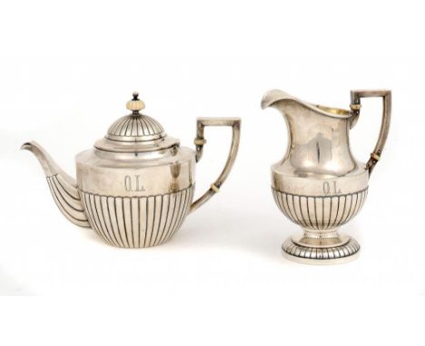 A FABERGÉ SILVER TEAPOT AND JUG  engraved with initials OL, ivory fittings, teapot 15.5cm h, maker's mark        35ozs ++Both