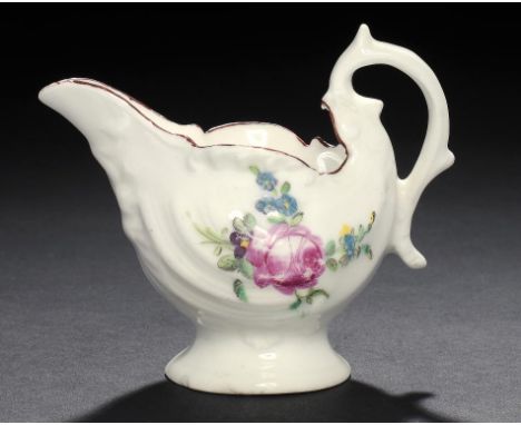 A DERBY POLYCHROME DOLPHIN EWER CREAMBOAT, C1770 enamelled with a rose spray to either side, 8.5cm h ++Typical wear to rust e