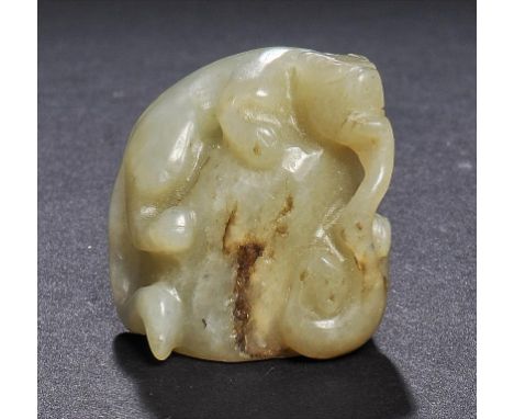 A CHINESE CELADON JADE PEBBLE CARVING OF A LEOPARD ON A ROCK, PROBABLY 19TH C 3cm h ++In good condition 