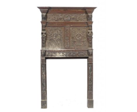AN ANTIQUARIAN TASTE CARVED OAK CHIMNEYPIECE, 19TH C  applied with  'Indian' and other heads, caryatids and grotesques, 217cm