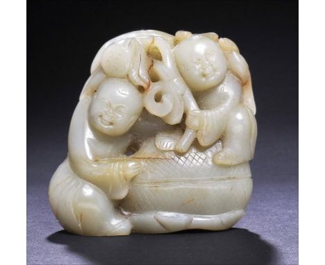A CHINESE JADE BOULDER CARVING, C LATE 19TH C  of two boys and a lotus pod, 8cm h, on a silver wire inlaid hardwood stand (2)