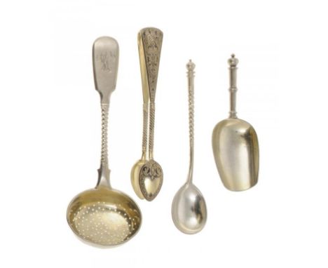 A RUSSIAN SILVER SUGAR SIFTER, CADDY SHOVEL AND TEASPOON BY            AND A PAIR OF RUSSIAN SILVER GILT AND NIELLO SUGAR BOW