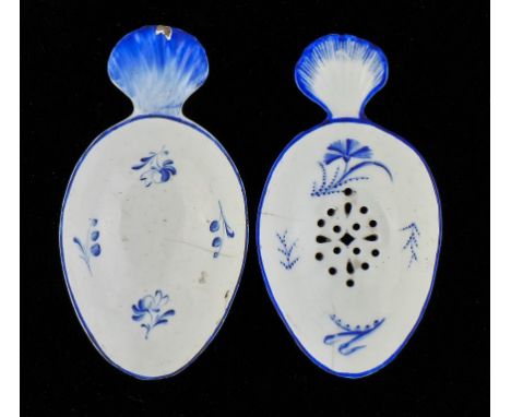 A DERBY 'DRY BLUE'   EGG DRAINER AND A CADDY SPOON, C1770  9.5 and 10cm l ++Egg drainer cracked, caddy spoon cracked, also wi