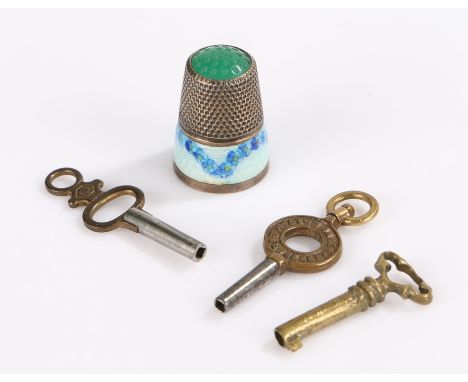 Sterling silver and enamel decorated thimble, watch and jewellery box keys (4)
