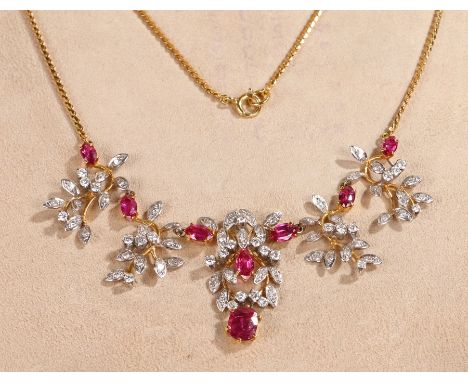 Fine 18 carat gold ruby and diamond necklace, the 18 carat gold chain with eight rubies and diamond set leaf surrounds, the l
