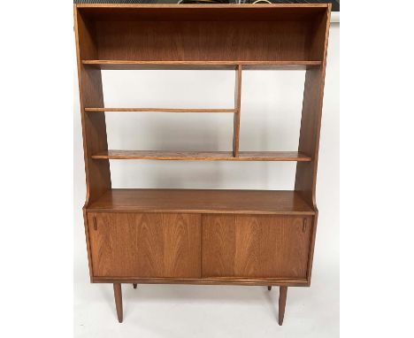 BOOKCASE, 1960s teak with open shelves above two sliding panel doors, 120cm W x 170cm H x 37cm D. 