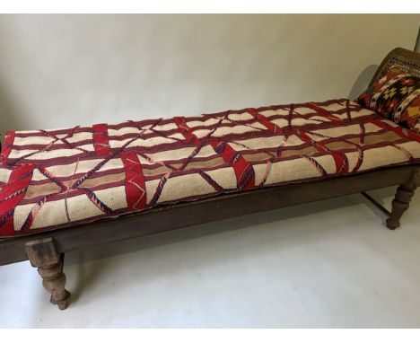 ANGLO INDIAN DAYBED/CHAISE, late 19th/early 20th century, North Indian teak and cane panelled, with quilted tribal kelim seat