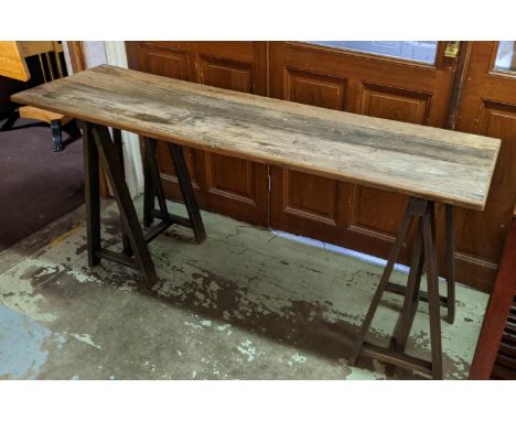 CONSOLE TABLE, 50cm D x 175cm L x 82cm H, distressed wooden top, on two trestle bases. 