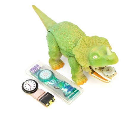 Swatch: a 1990's Skeleton dinosaur loom toy with swatch watch ref GK911, articulated legs and tail opening to reveal a swatch