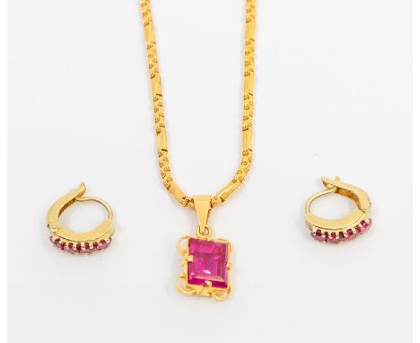 A 22ct gold and synthetic ruby set Indian pendant, comprising a rectangular cut stone claw set to a fancy wirework mount, sto