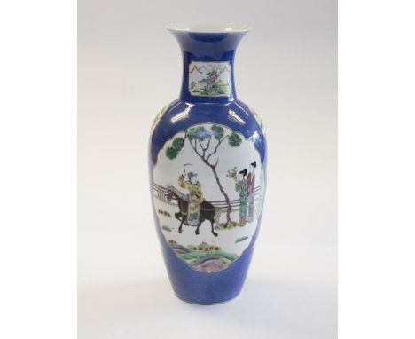 A Chinese powder blue ground porcelain vase, Qing Dynasty, late 19th century, ovoid body and trumpet neck, painted with panel