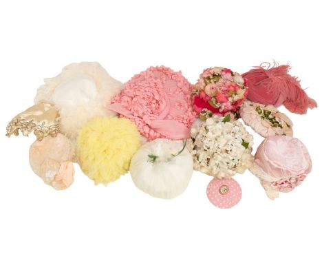 A collection of hats to include: large cream picture hat embellished with ostrich feathers; a deep pink velvet pillbox hat wi