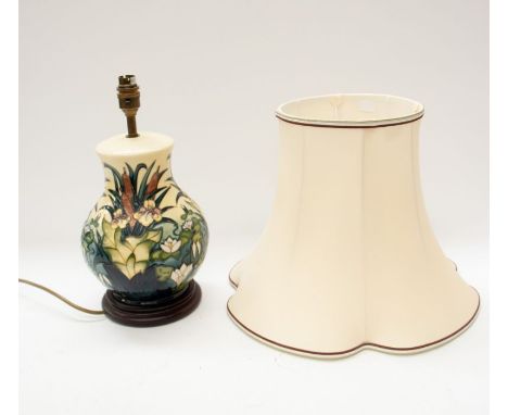 Moorcroft - A flowers/Bullrush designed lamp base, on wooden stand (covering base), electric and with shade. (2) Lamp approx.