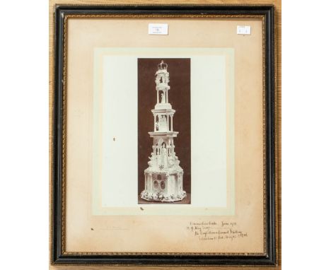   A rare black and white photograph of the Coronation cake for George V, inscribed in pen 'H.M. George V June 1911, the confe