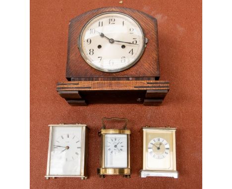 Early 20th century French brass carriage clock along with 1930's mantle clock and two battery carriage clocks.