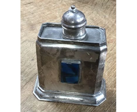 An Arts &amp; Crafts white metal tea caddy and cover, with blue enamel plaque to front. scratch Marked &lsquo;G.H. Evens&rsqu