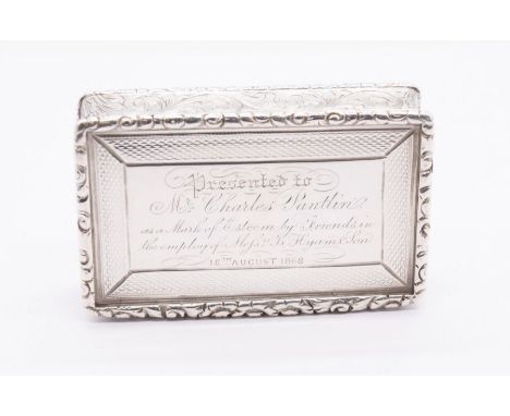 A Victorian silver snuff box, ornate border above sides engraved with scrolling foliage, the cover and base engine turned dec