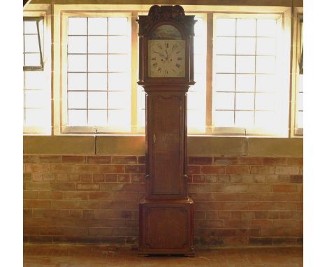 An arched enamel dial grandfather clock of VIII day duration striking on a bell in a oak case by Samualson of Salop Late 18th