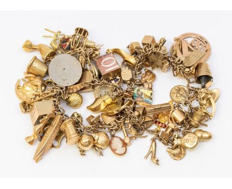 A 9ct gold charm bracelet, comprising various 9ct gold charms, mostly marked 9ct gold, to include Churchill, camera, £10, cam