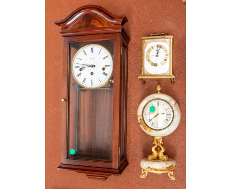 A small collection of clocks to include; a modern Comitti of London wooden cased wall clock with pendulum and key, a Metamec 