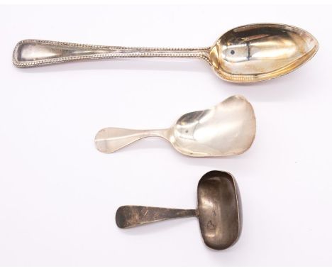 A George V Old English silver caddy spoon, hallmarked by C W Fletcher &amp; Sons., Sheffield, 1930 together with a shovel sha