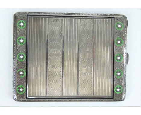 An early 20th Century Continental silver and enamel engine turned cigarette case, central section with engine turned panels, 