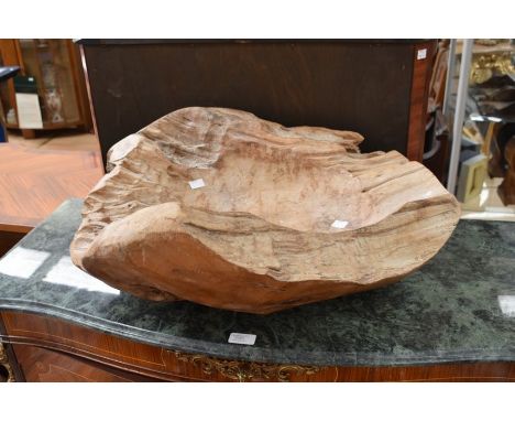 A large and carved wooden bowl made from trunk of tree. (no makers stamp).