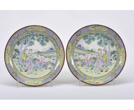 A pair of small plates, fully enamelled copper, polychrome decoration "Landscape with European figures", rim with pattern dec