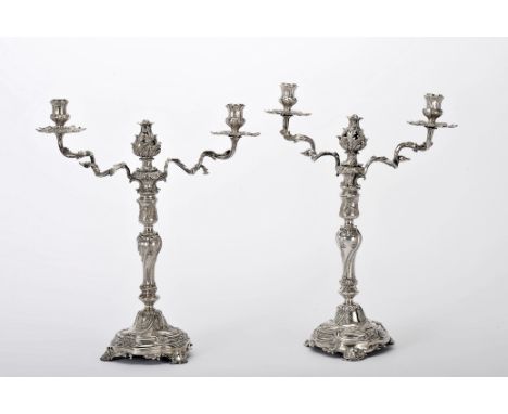 A pair of two-light candelabra, D. José I, King of Portugal (1750-1777), 833/1000 silver, engraved decoration en relief with 