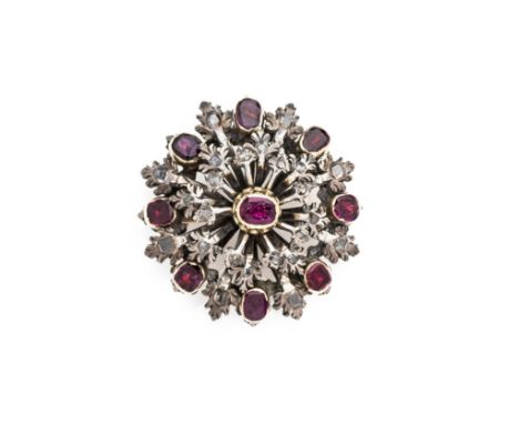 RUBY AND DIAMOND BROOCH, LATE 19TH CENTURY designed as a stylised flower head in the Historicist style set with oval mixed-cu